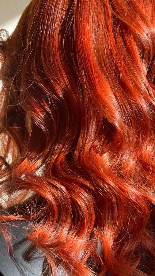 Vivid red colour and waves by Sharon's Mobile Hairdressing